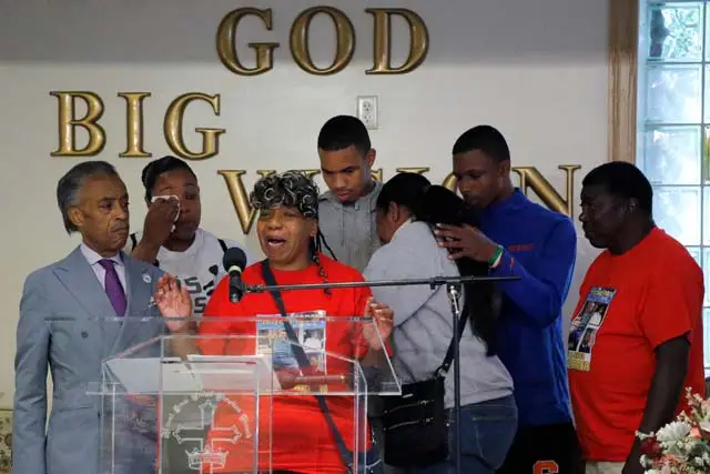 Gwen Carr mother of Eric Garner and other members of his family is joined by to Rev. Al Sharpton